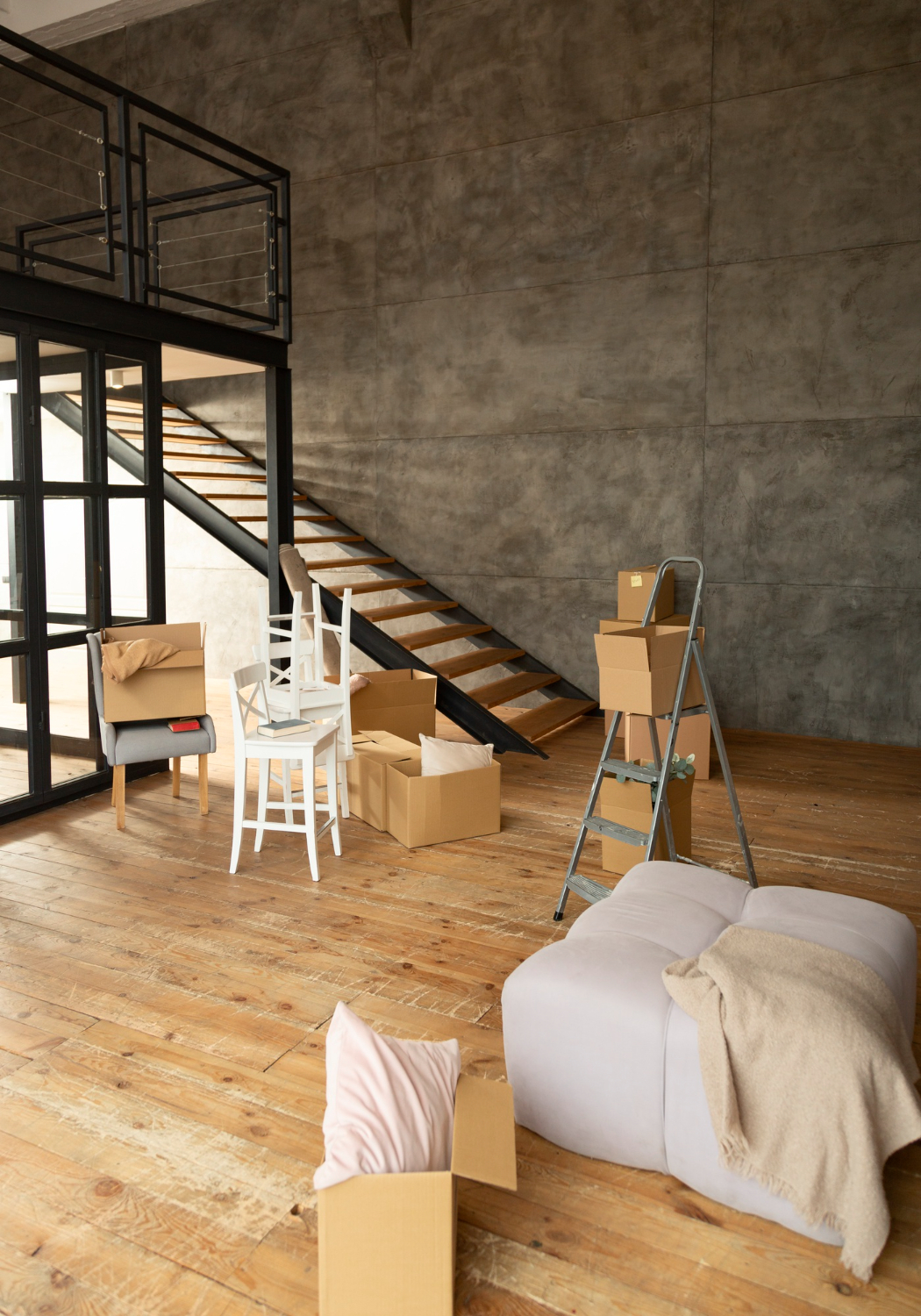 Finished basement renovation with wood flooring and modern staircase
