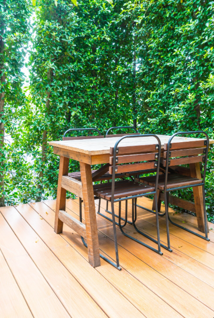 Outdoor deck remodel with wood patio and garden view