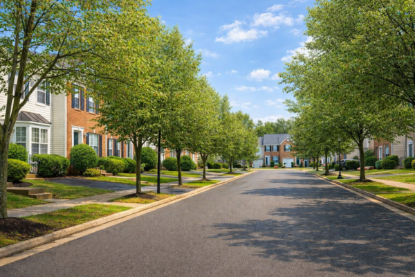 Tree-lined suburban street in Laurel, Maryland showcasing neighborhoods ideal for modular home construction and exterior remodeling projects.