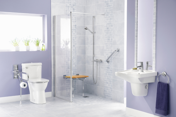 Accessible Bathroom Design for Aging in Place Accessible bathroom with a curbless walk-in shower, fold-down bench, grab bars and wall-hung sink designed for aging in place